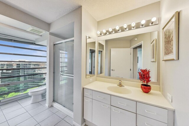 1720 Maple Ave Unit 1270, Evanston, IL 60201 - full bath featuring toilet, vanity, tile patterned floors, and a stall shower
