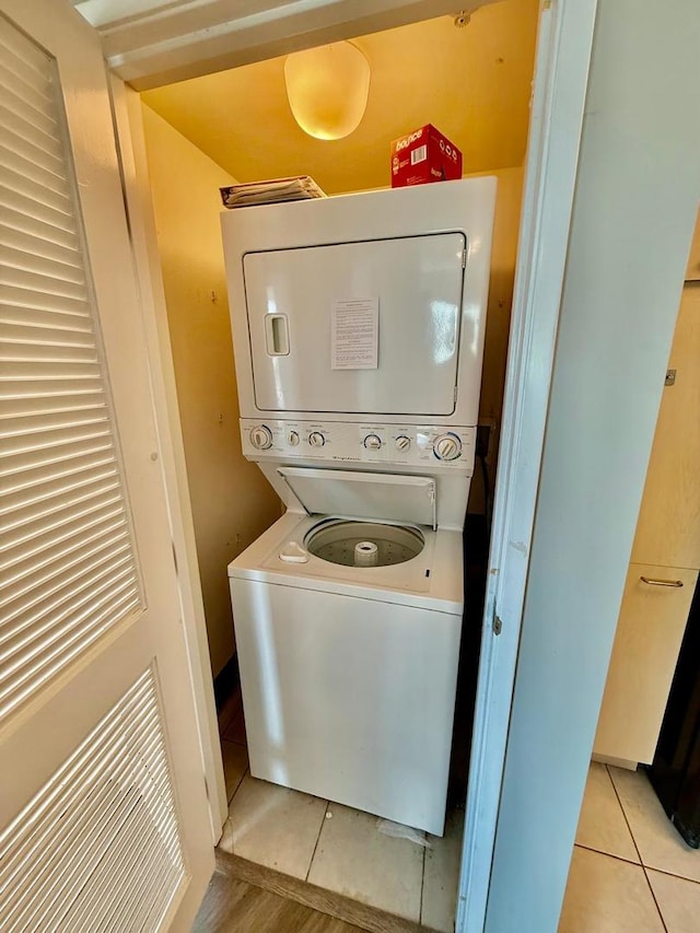 1720 Maple Ave Unit 1270, Evanston, IL 60201 - laundry area featuring estacked washer and dryer and light tile patterned floors