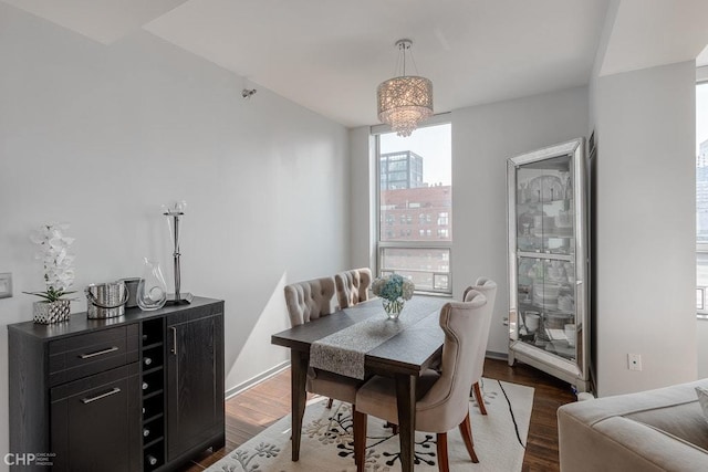 330 W Grand Ave Unit 2002, Chicago, IL 60654 - dining room featuring dark wood-style floors and a chandelier