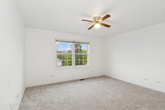 17083 W Tiger Tail Ct, Gurnee, IL 60031 - spare room featuring carpet, ceiling fan, and baseboards