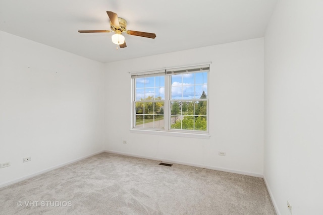 17083 W Tiger Tail Ct, Gurnee, IL 60031 - carpeted spare room with baseboards and a ceiling fan
