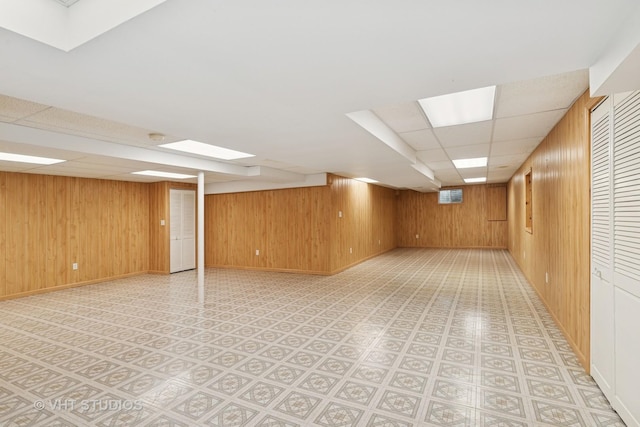 17083 W Tiger Tail Ct, Gurnee, IL 60031 - finished basement with wooden walls, a drop ceiling, and baseboards