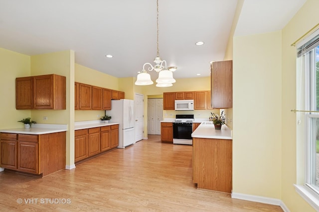 17083 W Tiger Tail Ct, Gurnee, IL 60031 - kitchen with white appliances, light wood-style floors, light countertops, brown cabinetry, and recessed lighting