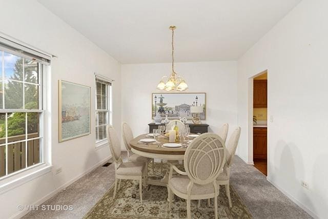 17083 W Tiger Tail Ct, Gurnee, IL 60031 - dining space with a chandelier, carpet floors, and baseboards