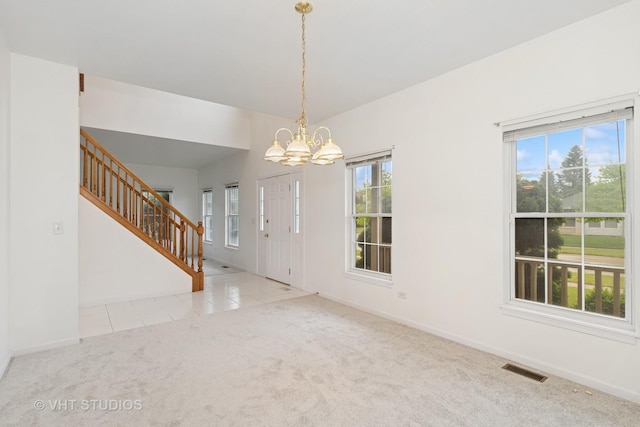 17083 W Tiger Tail Ct, Gurnee, IL 60031 - entrance foyer featuring a chandelier, stairway, carpet flooring, and healthy amount of natural light