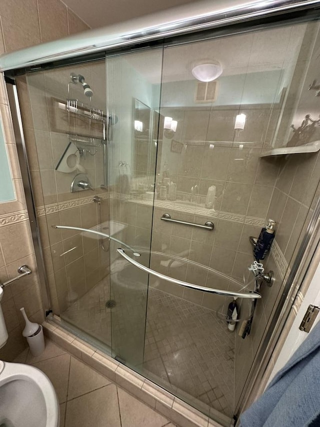 7033 N Kedzie Ave Unit 301, Chicago, IL 60645 - full bathroom with a stall shower, tile patterned floors, a bidet, and toilet
