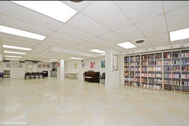 7033 N Kedzie Ave Unit 301, Chicago, IL 60645 - misc room with a paneled ceiling and tile patterned floors