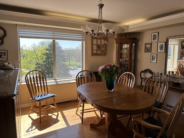 7033 N Kedzie Ave Unit 301, Chicago, IL 60645 - dining space with a chandelier and light wood finished floors