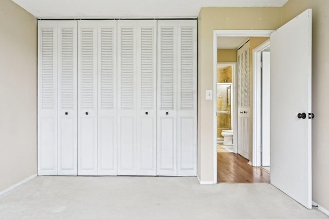 1116 S New Wilke Rd Unit 408, Arlington Heights, IL 60005 - unfurnished bedroom with carpet floors, a closet, and baseboards