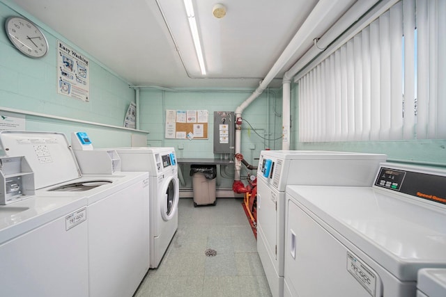 1116 S New Wilke Rd Unit 408, Arlington Heights, IL 60005 - shared laundry room featuring separate washer and dryer, concrete block wall, light flooring, and a baseboard heating unit