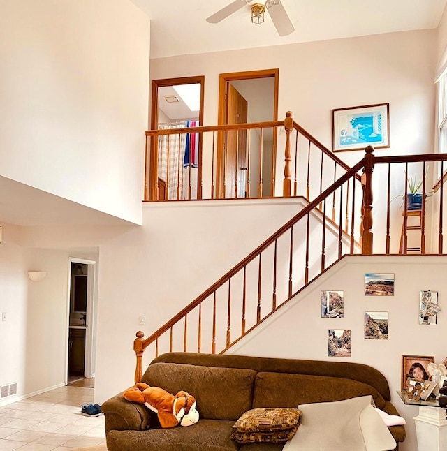 1300 Edington Ln, Mundelein, IL 60060 - stairway with a high ceiling, a ceiling fan, and tile patterned floors