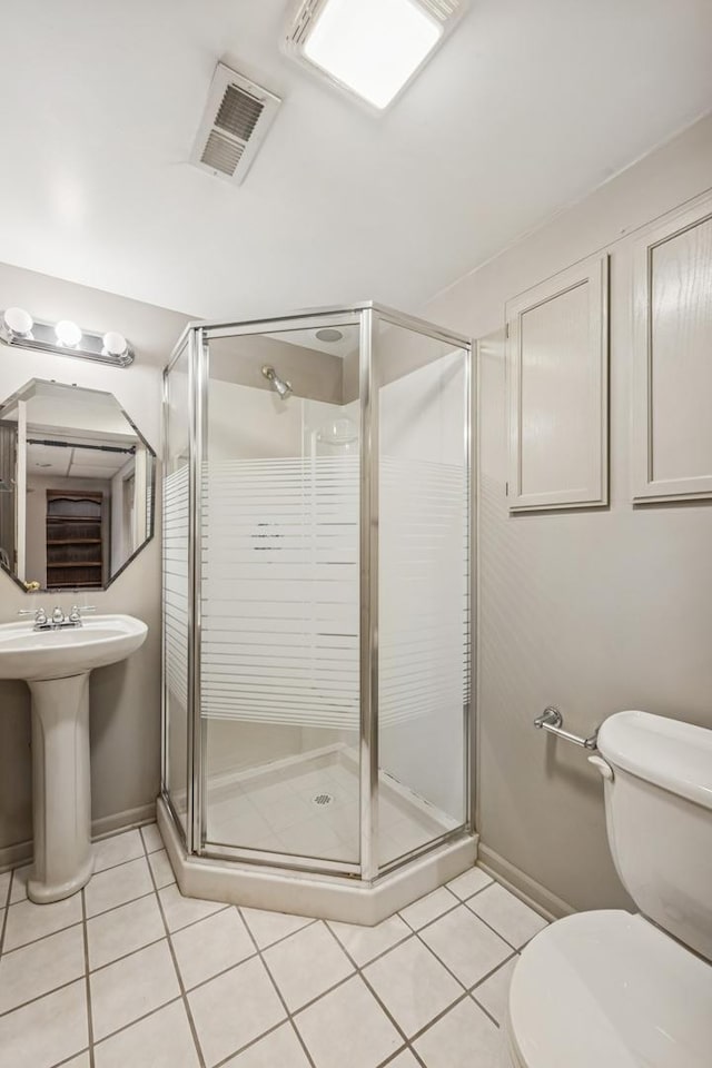 6173 Dixon Dr, Lisle, IL 60532 - bathroom with toilet, tile patterned floors, a shower stall, and baseboards