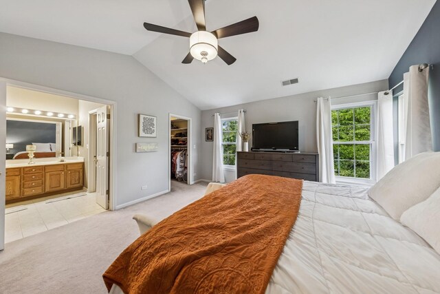 6173 Dixon Dr, Lisle, IL 60532 - bedroom featuring vaulted ceiling, light colored carpet, a spacious closet, baseboards, and a ceiling fan