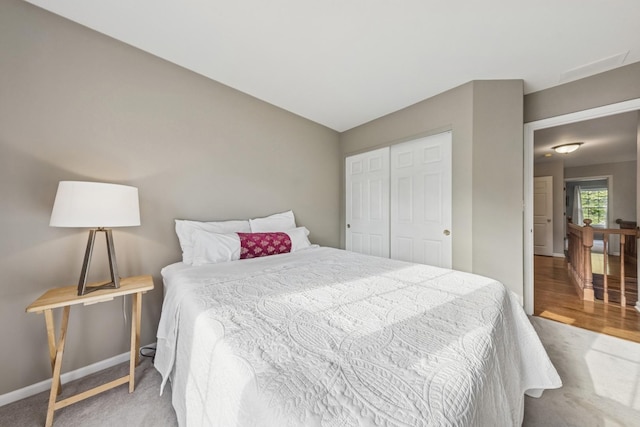 6173 Dixon Dr, Lisle, IL 60532 - carpeted bedroom featuring baseboards, a closet, and wood finished floors