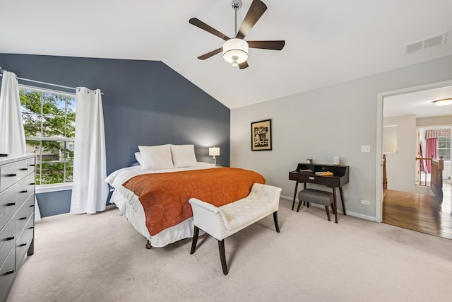 6173 Dixon Dr, Lisle, IL 60532 - bedroom featuring light carpet, vaulted ceiling, multiple windows, ceiling fan, and baseboards