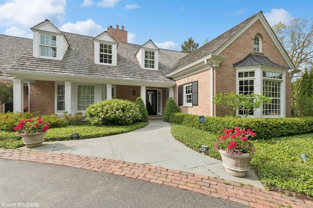 770 E Westminster Rd, Lake Forest, IL 60045 - cape cod-style house featuring brick siding and a chimney
