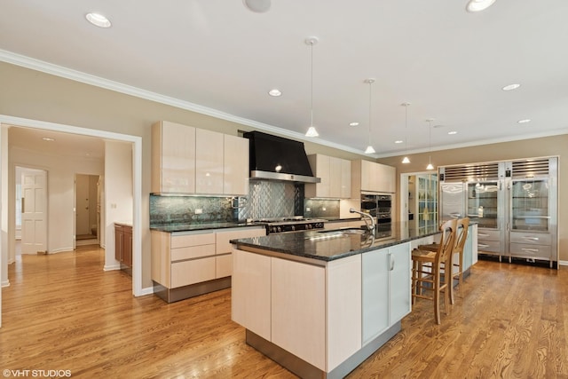 770 E Westminster Rd, Lake Forest, IL 60045 - kitchen featuring wall chimney exhaust hood, appliances with stainless steel finishes, ornamental molding, backsplash, and modern cabinets
