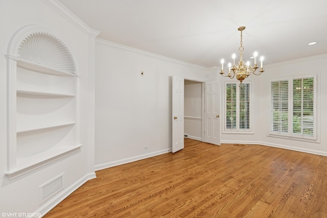 770 E Westminster Rd, Lake Forest, IL 60045 - empty room with a chandelier, crown molding, wood finished floors, and built in features
