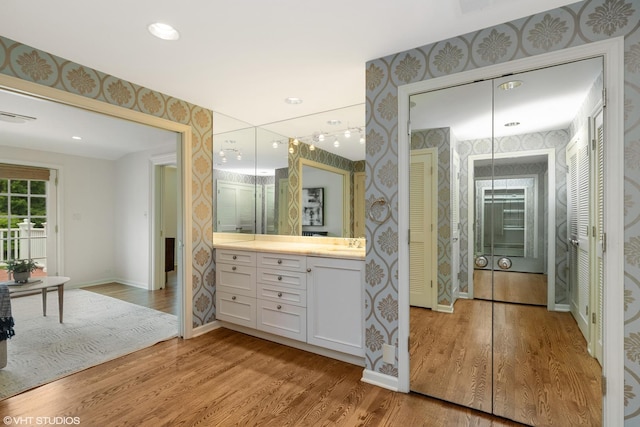 770 E Westminster Rd, Lake Forest, IL 60045 - bathroom featuring wallpapered walls, vanity, and wood finished floors