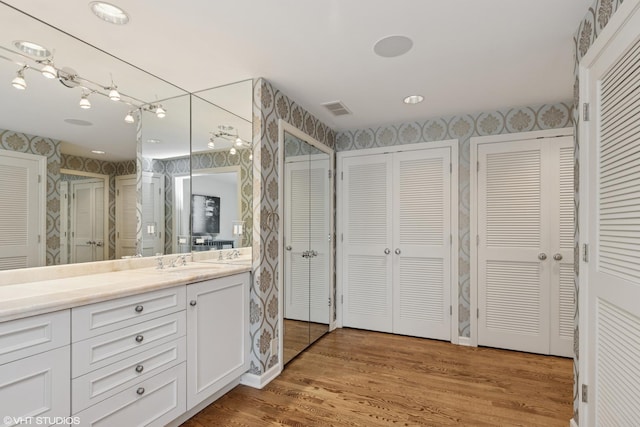 770 E Westminster Rd, Lake Forest, IL 60045 - bathroom with a closet, wallpapered walls, vanity, wood finished floors, and an enclosed shower