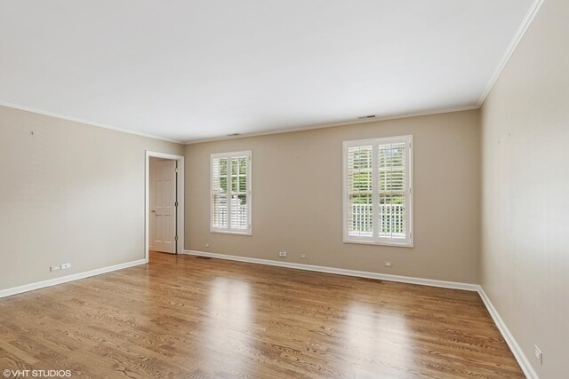 770 E Westminster Rd, Lake Forest, IL 60045 - spare room featuring crown molding and wood finished floors
