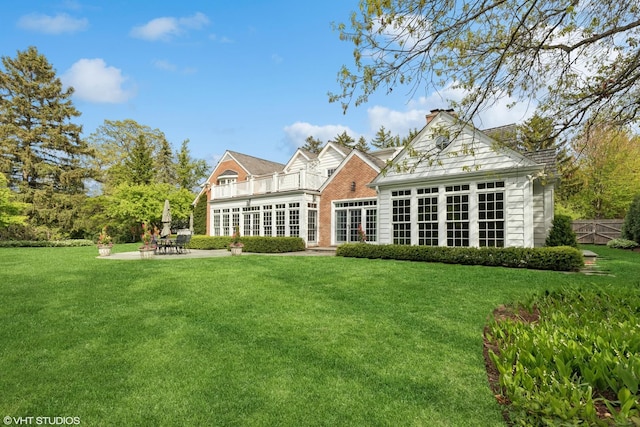 770 E Westminster Rd, Lake Forest, IL 60045 - back of property with a patio area, a balcony, and a lawn