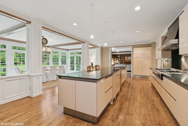 770 E Westminster Rd, Lake Forest, IL 60045 - kitchen featuring crown molding, light wood-type flooring, a large island, hanging light fixtures, and recessed lighting