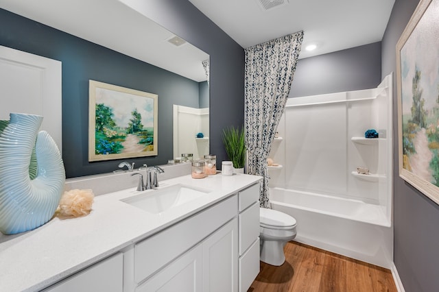 2262 Stonegate Rd, Algonquin, IL 60102 - full bathroom featuring wood finished floors, toilet, vanity, and shower / washtub combination