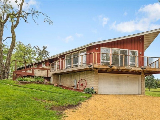 4560 Centerville Rd, Rockford, IL 61102 - view of front facade with dirt driveway, a garage, a front yard, and brick siding