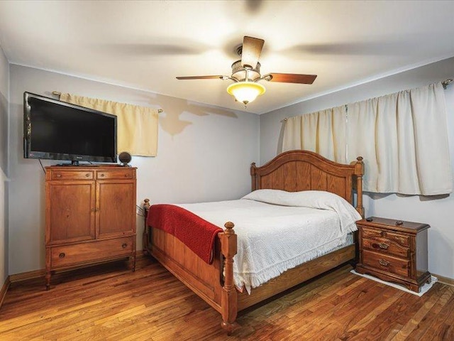 4560 Centerville Rd, Rockford, IL 61102 - bedroom featuring wood finished floors, a ceiling fan, and baseboards