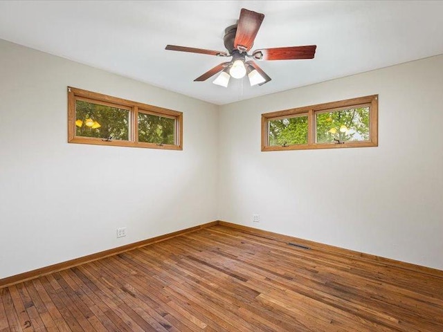 4560 Centerville Rd, Rockford, IL 61102 - spare room with wood-type flooring, baseboards, and ceiling fan