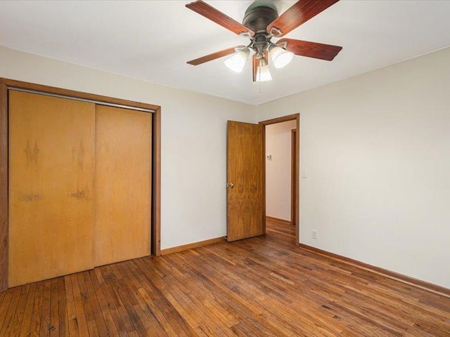 4560 Centerville Rd, Rockford, IL 61102 - unfurnished bedroom featuring wood-type flooring, a closet, baseboards, and ceiling fan