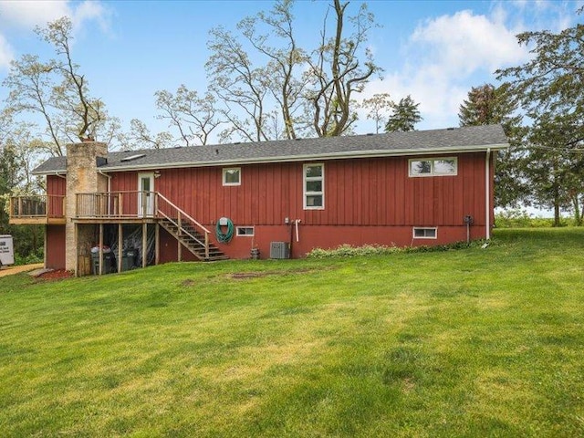 4560 Centerville Rd, Rockford, IL 61102 - back of property featuring stairs, a wooden deck, a lawn, and a chimney