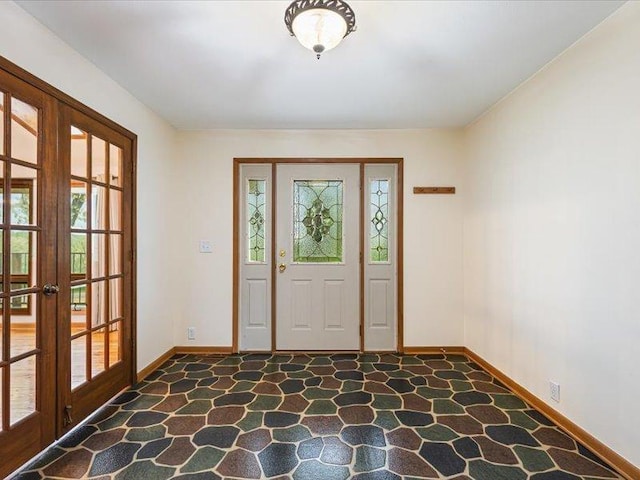 4560 Centerville Rd, Rockford, IL 61102 - entrance foyer featuring plenty of natural light, stone floors, baseboards, and french doors