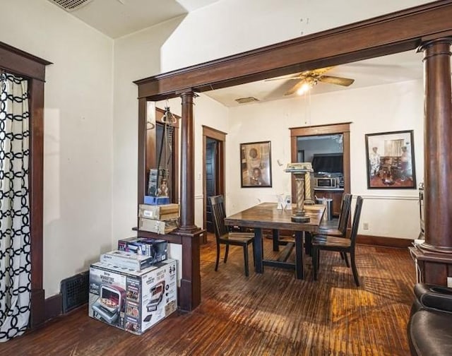 4560 Centerville Rd, Rockford, IL 61102 - dining room featuring decorative columns, wood finished floors, a ceiling fan, and baseboards