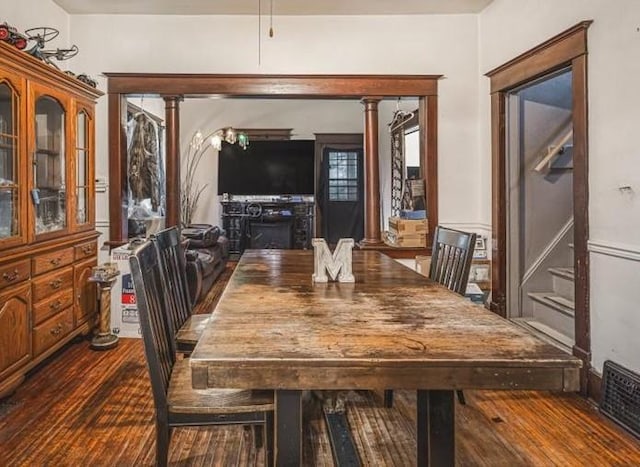 4560 Centerville Rd, Rockford, IL 61102 - dining space featuring dark wood finished floors and ornate columns