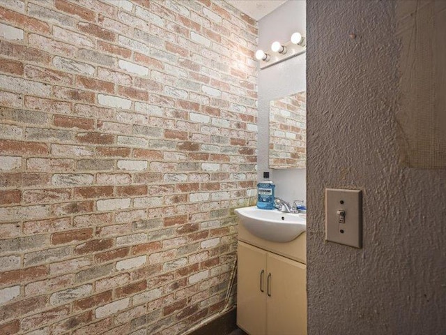 4560 Centerville Rd, Rockford, IL 61102 - bathroom with vanity and brick wall