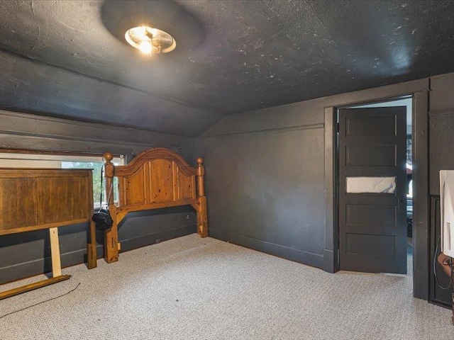 4560 Centerville Rd, Rockford, IL 61102 - unfurnished bedroom featuring carpet and lofted ceiling