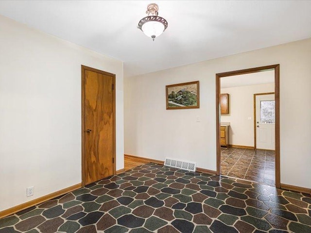 4560 Centerville Rd, Rockford, IL 61102 - unfurnished room featuring stone floors and baseboards
