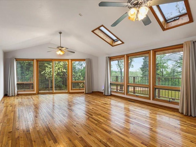 4560 Centerville Rd, Rockford, IL 61102 - unfurnished living room with a skylight, ceiling fan, vaulted ceiling, and light wood-type flooring