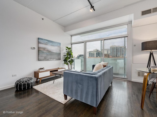 630 N Franklin St Unit 817, Chicago, IL 60654 - living area with dark wood-type flooring, rail lighting, baseboards, and a view of city