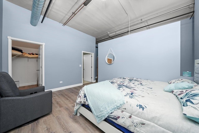 1516 S Wabash Ave Unit 306, Chicago, IL 60605 - bedroom featuring wood finished floors, a spacious closet, and a closet