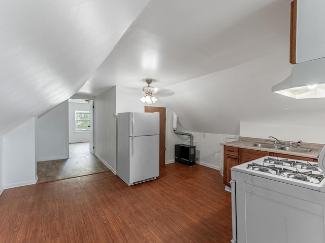 2531 N Lotus Ave, Chicago, IL 60639 - kitchen with white appliances, a sink, wood finished floors, lofted ceiling, and baseboards