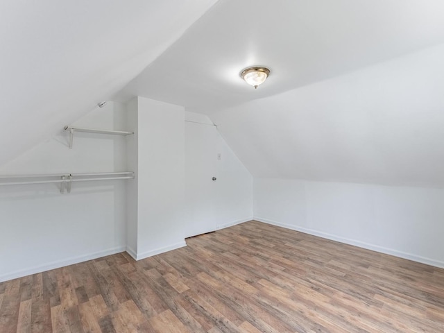 2531 N Lotus Ave, Chicago, IL 60639 - bonus room featuring vaulted ceiling, wood finished floors, and baseboards