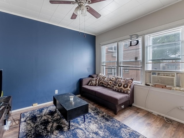 2531 N Lotus Ave, Chicago, IL 60639 - living room with a ceiling fan, wood finished floors, cooling unit, crown molding, and baseboards