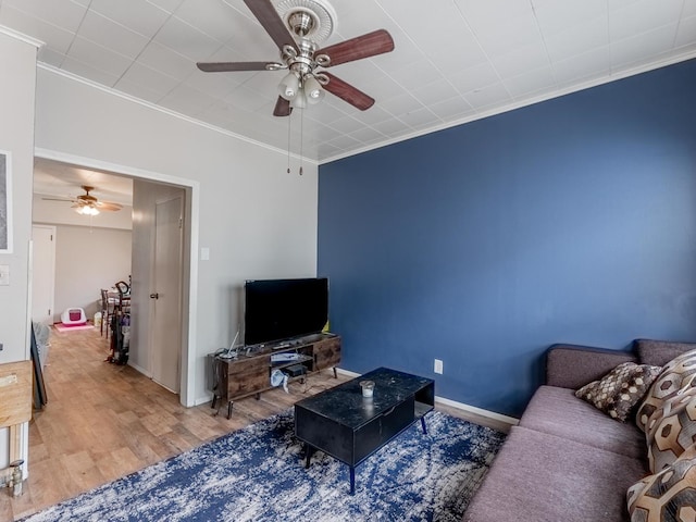2531 N Lotus Ave, Chicago, IL 60639 - living room with ceiling fan, crown molding, wood finished floors, and baseboards