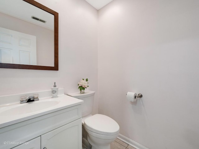 2393 N Wayne Ave, Chicago, IL 60614 - bathroom featuring vanity, toilet, tile patterned floors, and baseboards