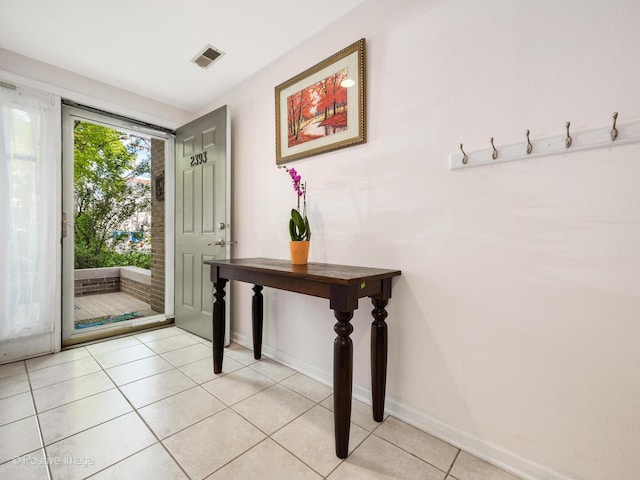 2393 N Wayne Ave, Chicago, IL 60614 - entryway with baseboards and light tile patterned floors