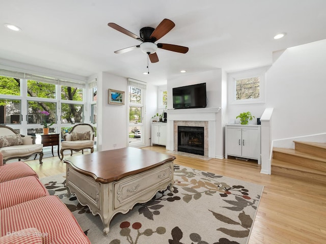 2393 N Wayne Ave, Chicago, IL 60614 - living area featuring ceiling fan, a fireplace with flush hearth, light wood-style flooring, recessed lighting, and stairway