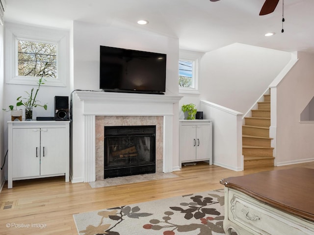 2393 N Wayne Ave, Chicago, IL 60614 - living area with ceiling fan, light wood-style flooring, stairs, recessed lighting, and a tile fireplace